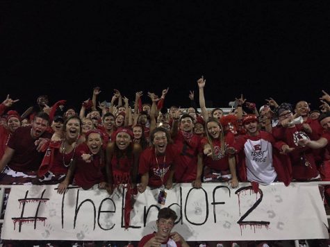 The Tribe intensley cheering on the Scarlets football team during their 31-14 victory against Des Moines Lincoln High School.