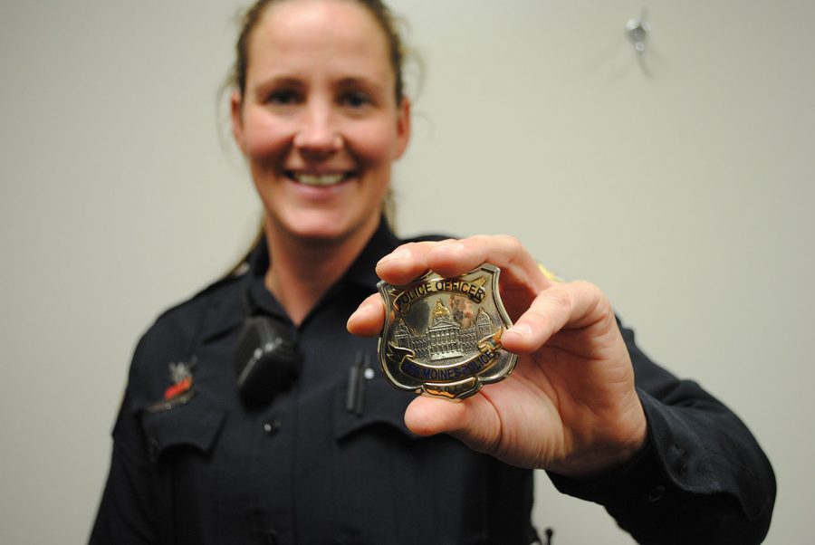 School+Resource+Officer+Trudy+shows+her+badge.+She+has+worked+at+East+for+two+years.