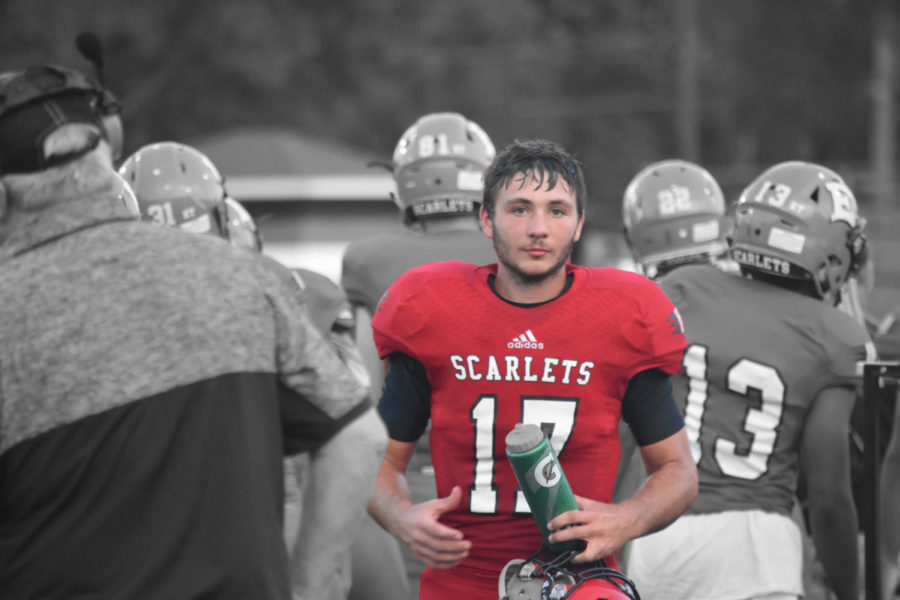 Quarterback, Corey Mills poses for a picture before heading back onto the field. 