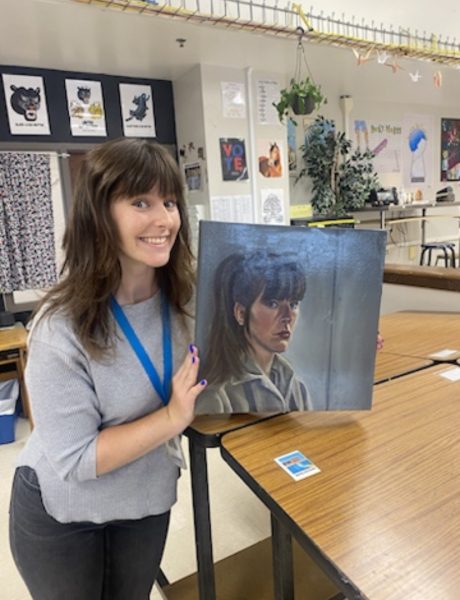 Ryan Koning with her self-portrait she created in college. 